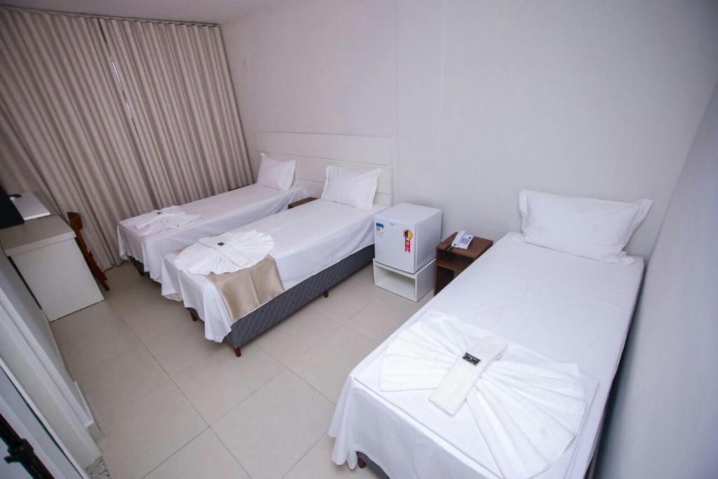 Postel nebo postele na pokoji v ubytování Hotel Portal Guanambi