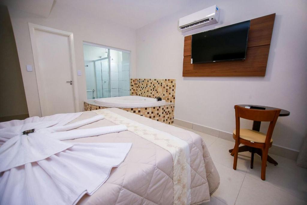 Postel nebo postele na pokoji v ubytování Hotel Portal Guanambi