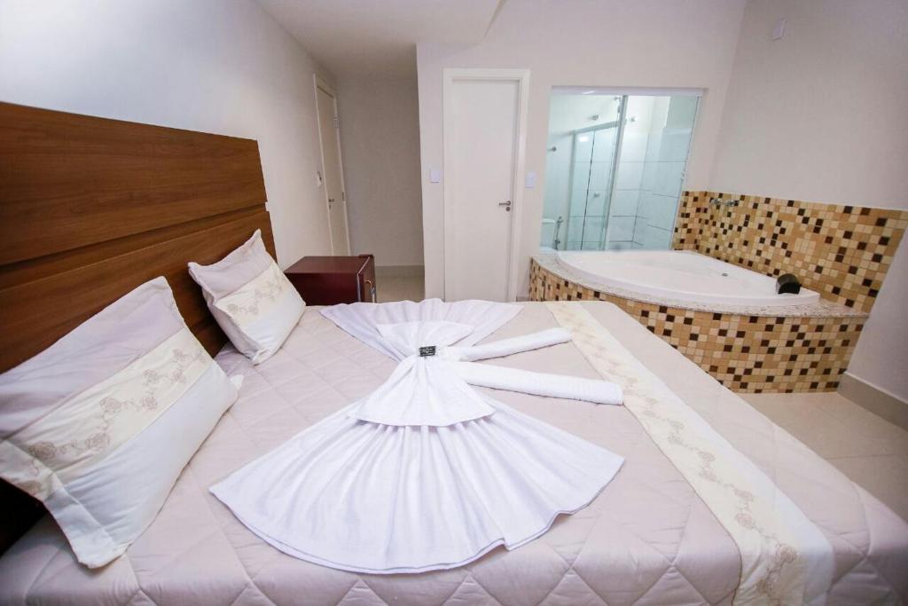 Postel nebo postele na pokoji v ubytování Hotel Portal Guanambi
