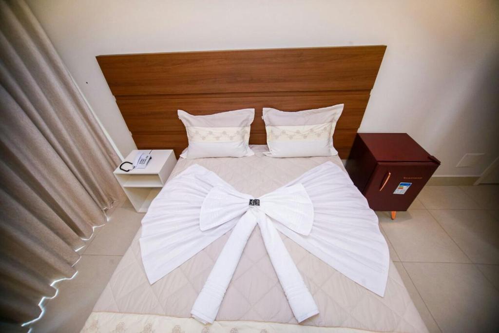Postel nebo postele na pokoji v ubytování Hotel Portal Guanambi