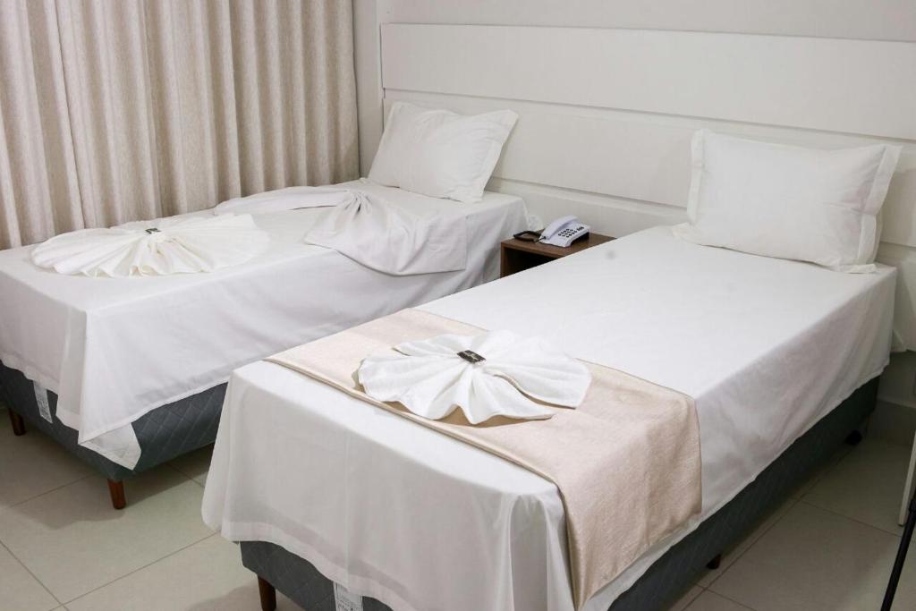 Postel nebo postele na pokoji v ubytování Hotel Portal Guanambi