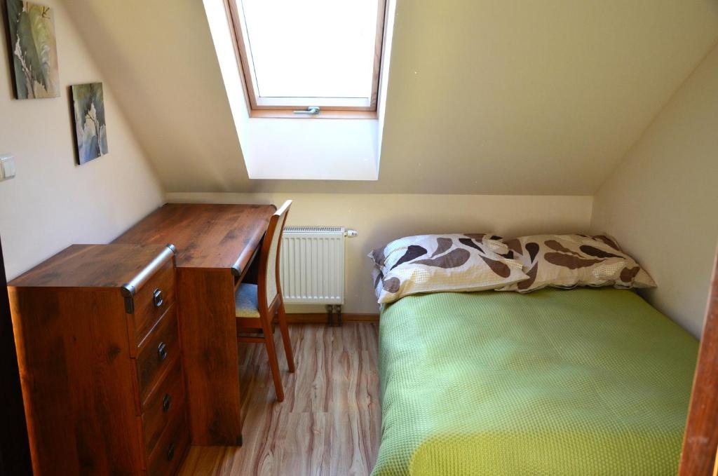 Postel nebo postele na pokoji v ubytování Zofijówka