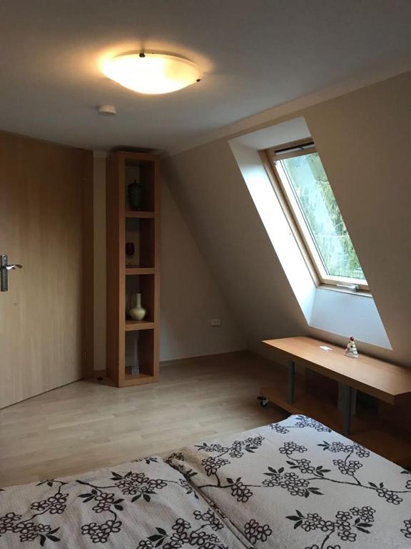 Posteľ alebo postele v izbe v ubytovaní Leśny Dwór