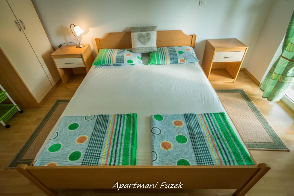 Postel nebo postele na pokoji v ubytování apartmani Puzek