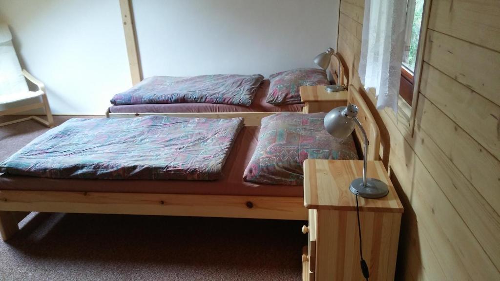 Postel nebo postele na pokoji v ubytování Autocamp Skalice