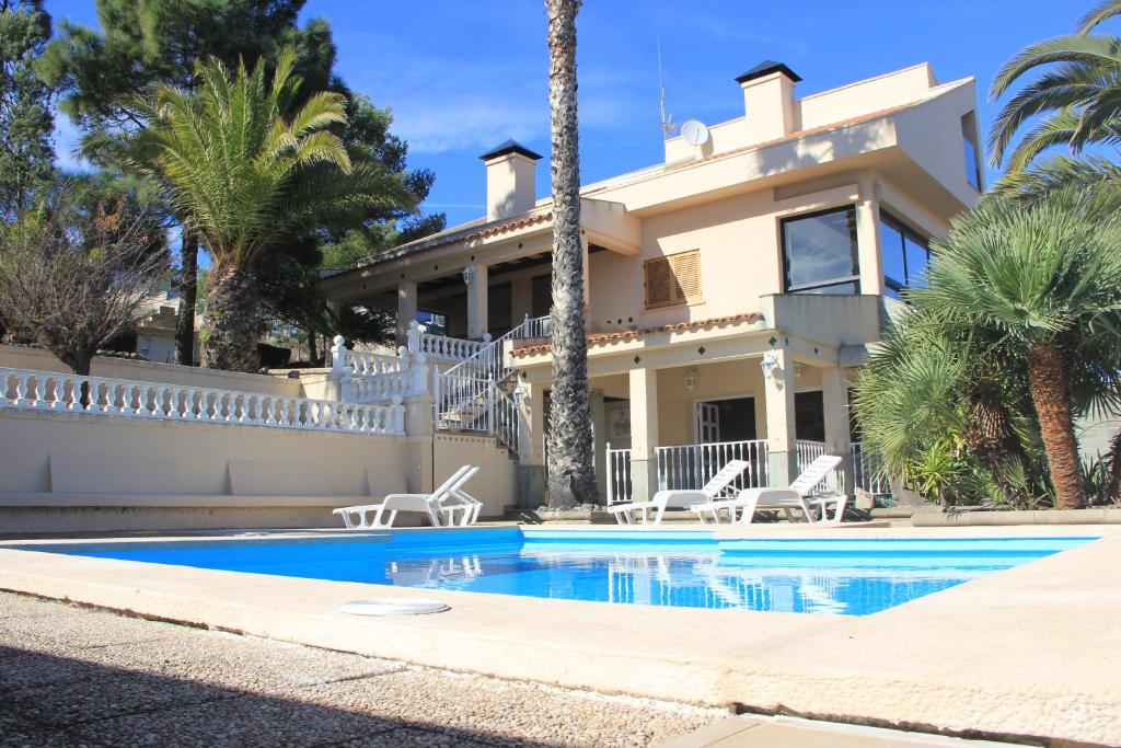 a house with a swimming pool in front of it at Teresita High Views with private pool in Santa Brígida