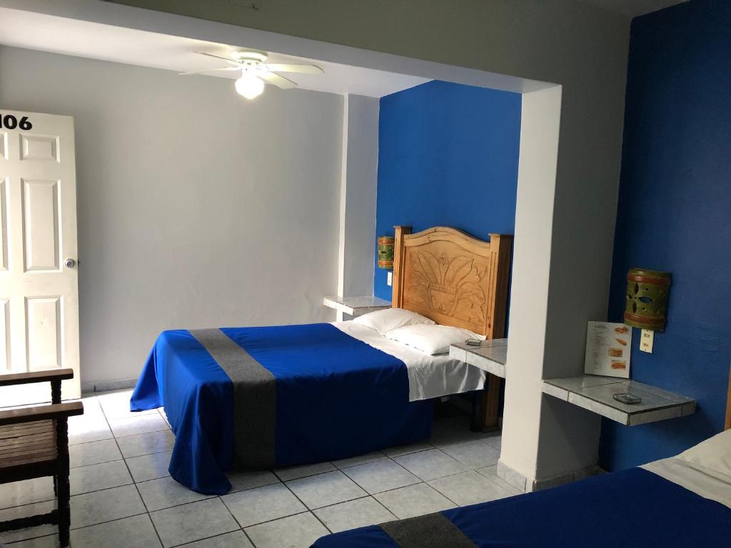 Postel nebo postele na pokoji v ubytování Hotel San Juan