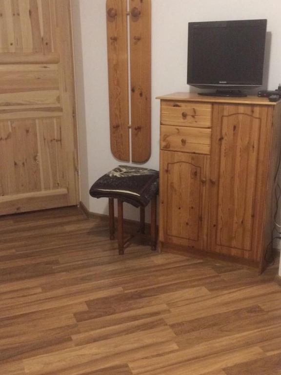 Televízia a/alebo spoločenská miestnosť v ubytovaní UDany Wypoczynek