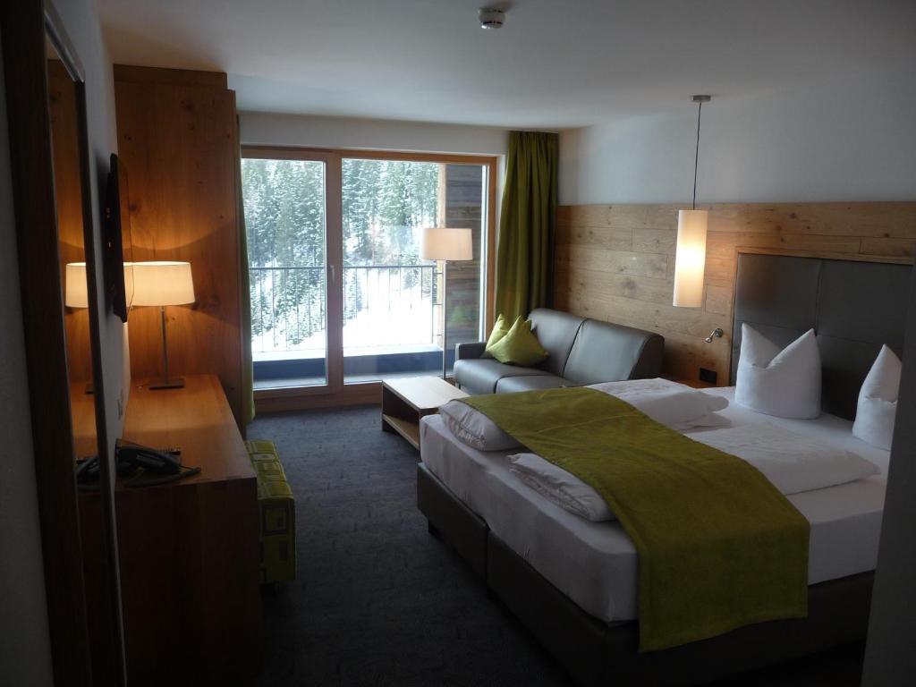 Postel nebo postele na pokoji v ubytování Hotel Garni Fimba