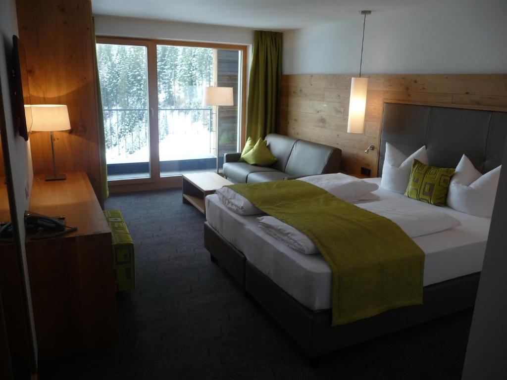 Postel nebo postele na pokoji v ubytování Hotel Garni Fimba