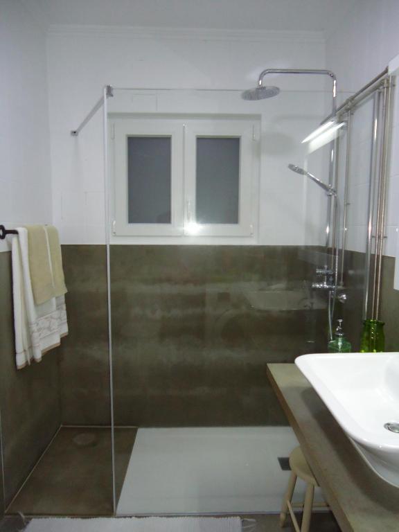 a bathroom with a shower and a sink at Casa da Quinta in Vila Franca do Campo