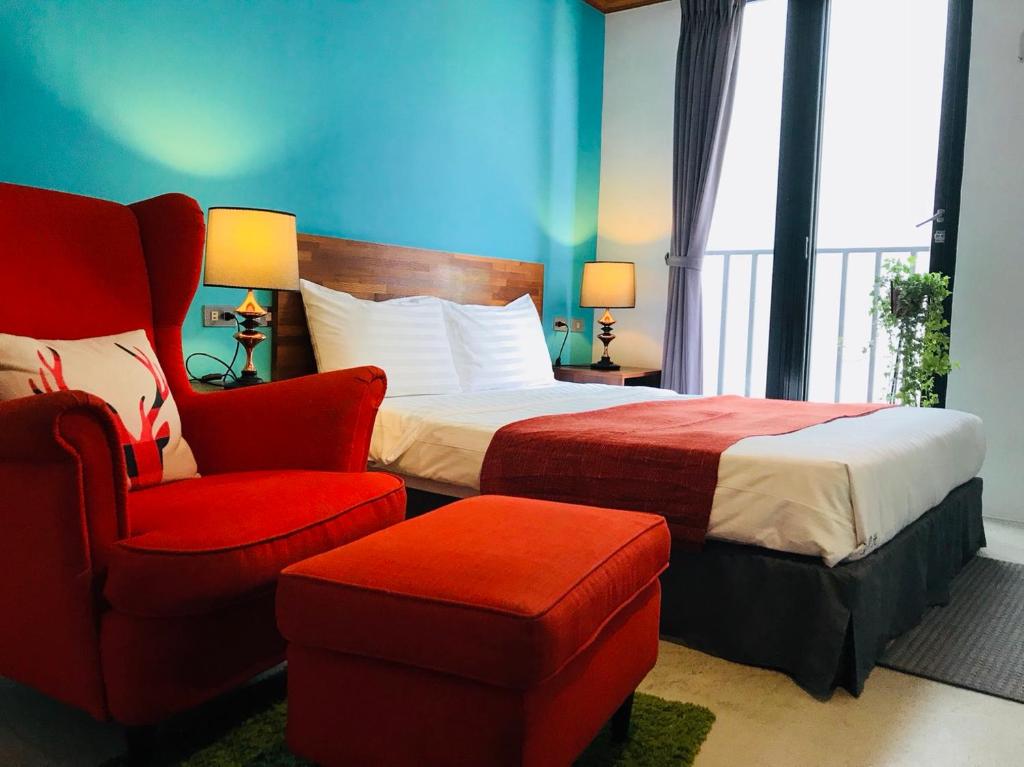 Rúm í herbergi á Kenting Cozy B&B