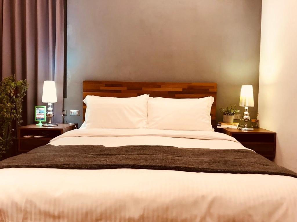 Rúm í herbergi á Kenting Cozy B&B