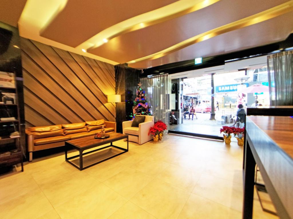 a lobby with a christmas tree in a store at Beauty Hotels Taipei - Hotel B6 in Taipei