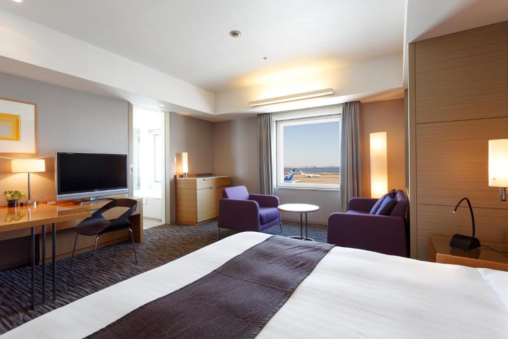 a hotel room with a bed and a television at Haneda Excel Hotel Tokyu Haneda Airport Terminal 2 in Tokyo