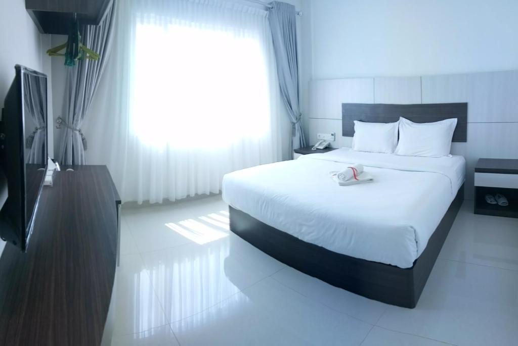 Postel nebo postele na pokoji v ubytování Seventeen Hotel