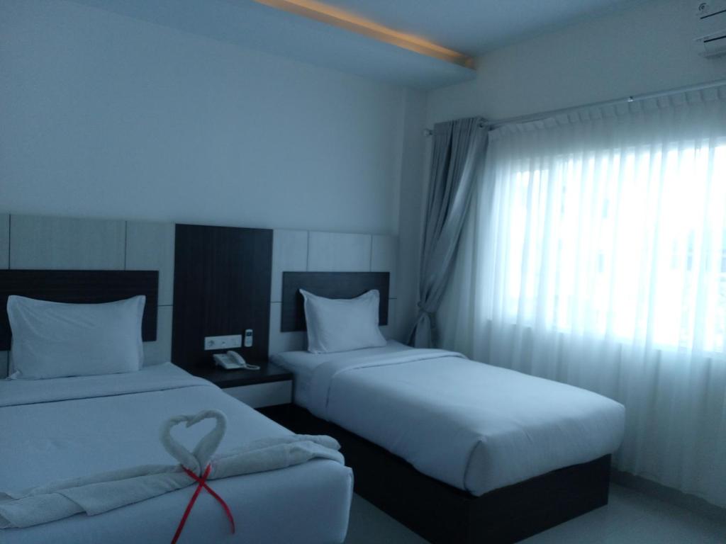 Postel nebo postele na pokoji v ubytování Seventeen Hotel