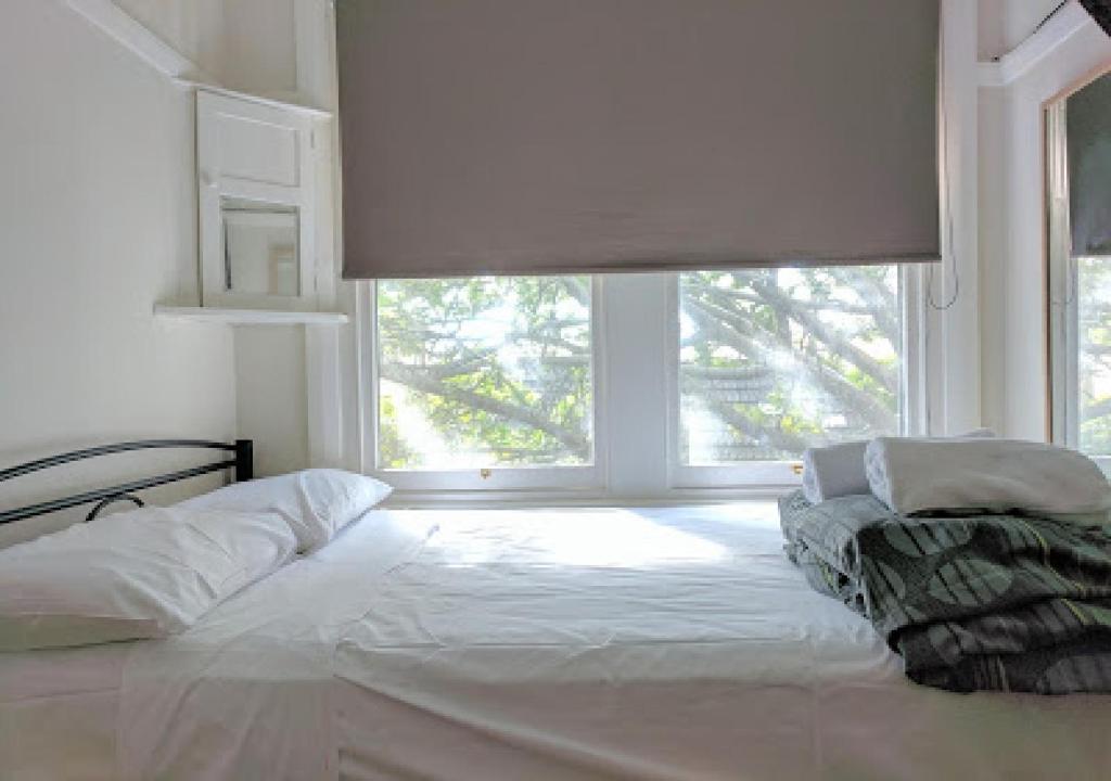 Postel nebo postele na pokoji v ubytování Highfield Private Hotel