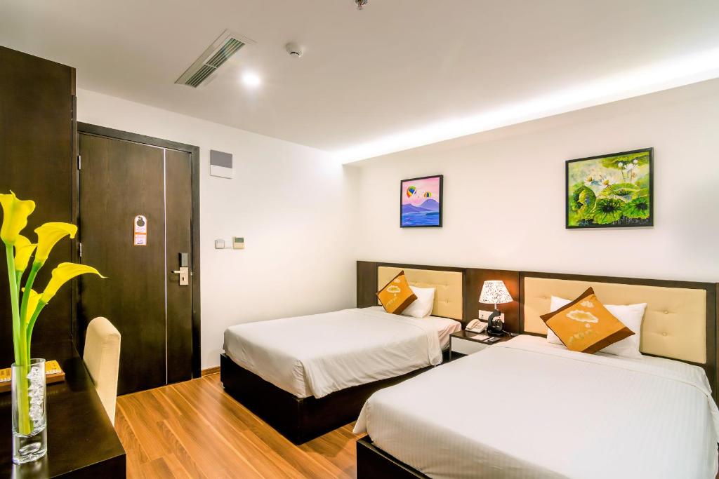 Postel nebo postele na pokoji v ubytování Dana Marina Boutique Hotel