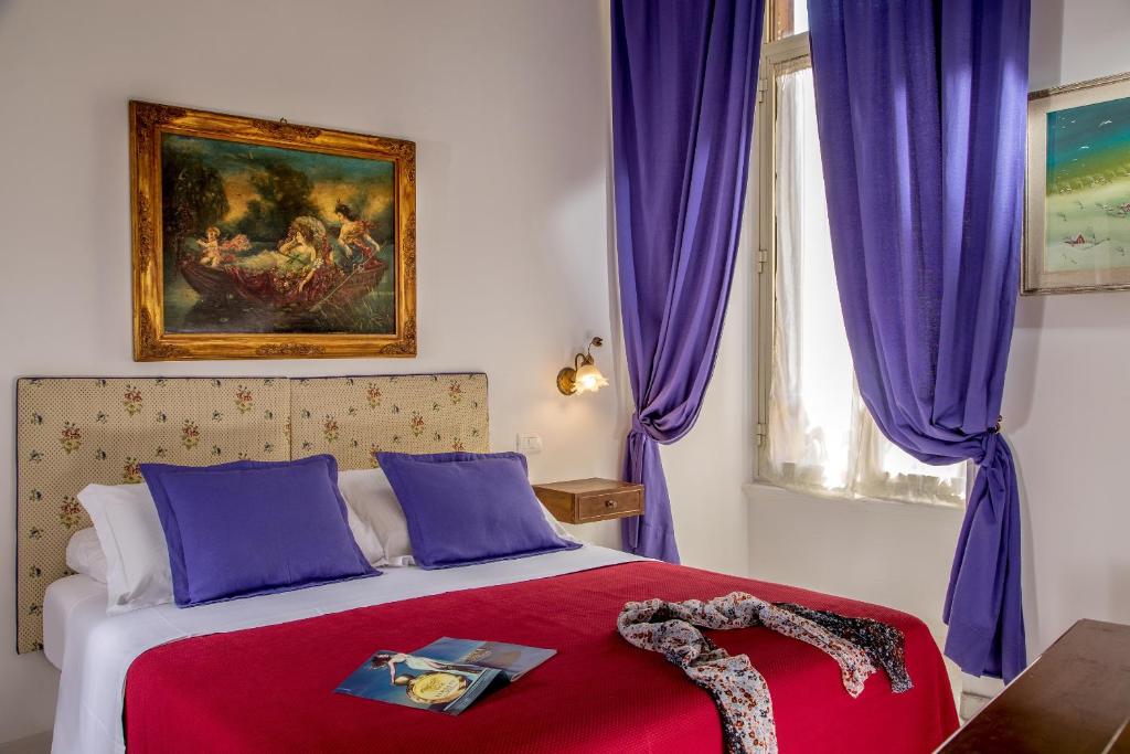 Postel nebo postele na pokoji v ubytování Roma Central Guest House