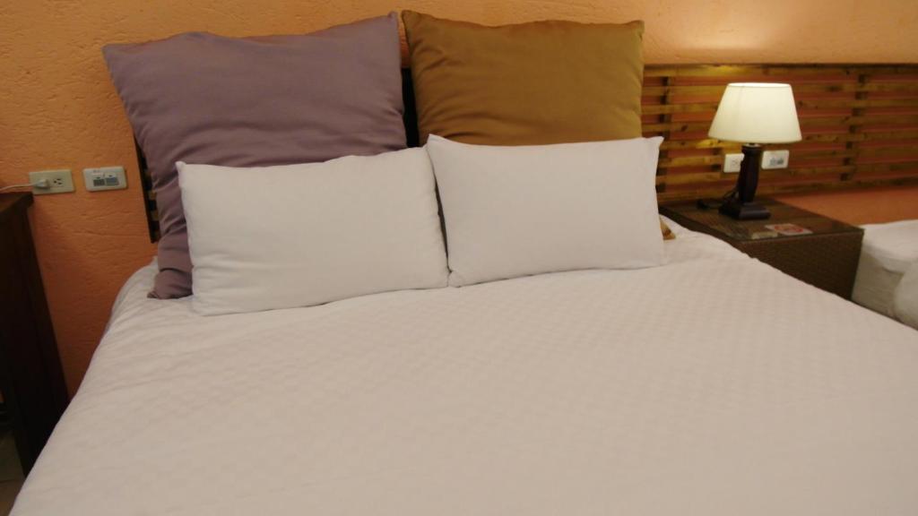 Postel nebo postele na pokoji v ubytování 小島旅店Island Inn