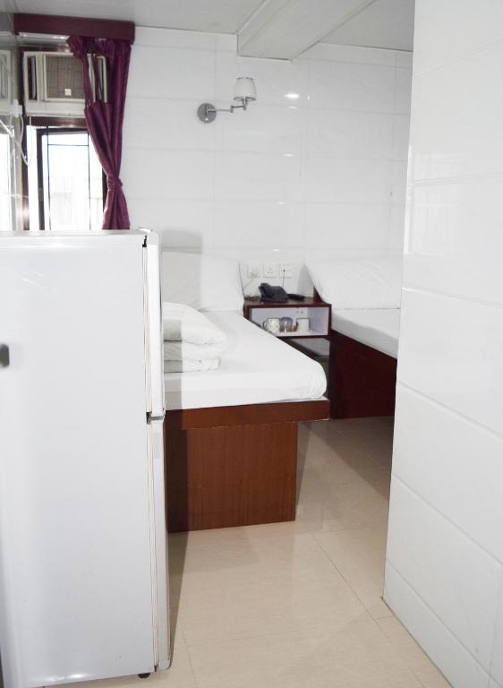 Kuchyň nebo kuchyňský kout v ubytování Pay-Less Guesthouse (7/F A9)
