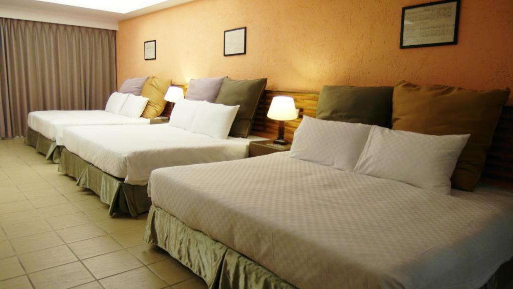Postel nebo postele na pokoji v ubytování 小島旅店Island Inn