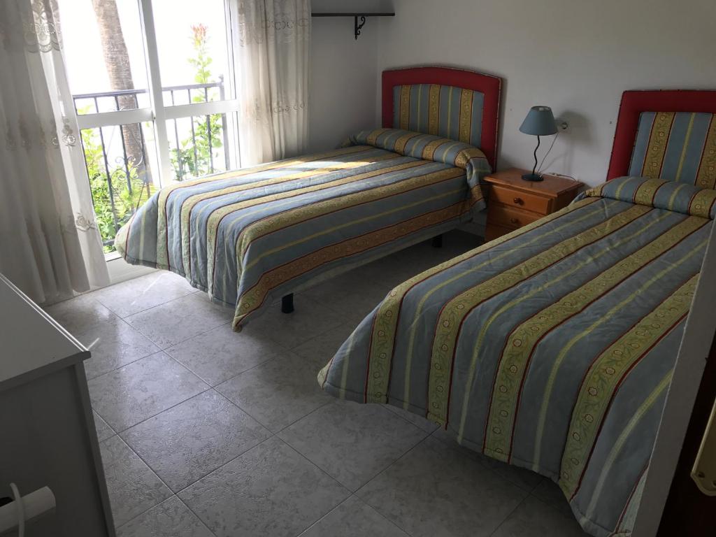 A bed or beds in a room at Casa playa el Torreon