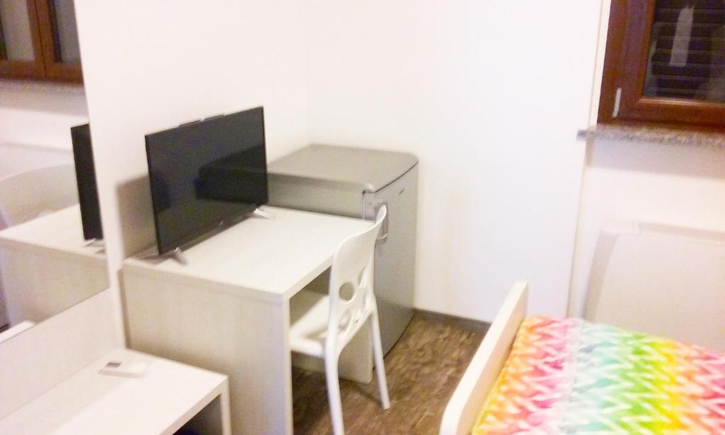 TV a/nebo společenská místnost v ubytování Residenza Borgazzi CIR S00031