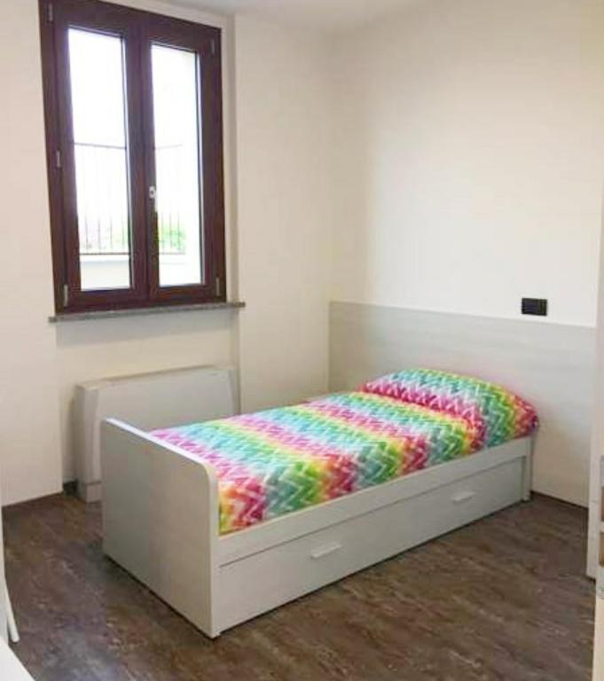 Postel nebo postele na pokoji v ubytování Residenza Borgazzi CIR S00031