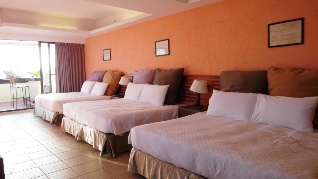 Postel nebo postele na pokoji v ubytování 小島旅店Island Inn