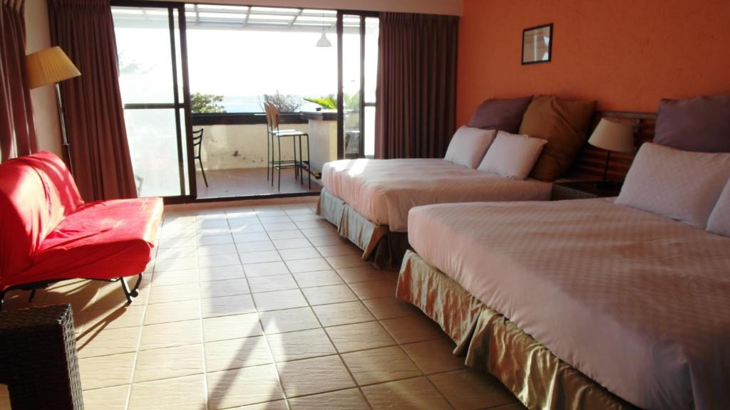 Postel nebo postele na pokoji v ubytování 小島旅店Island Inn