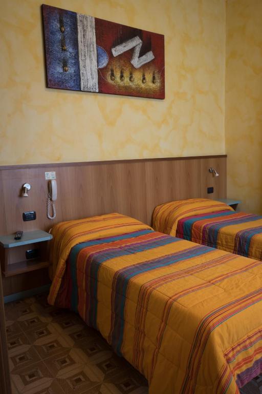 Postel nebo postele na pokoji v ubytování Albergo Etrusco