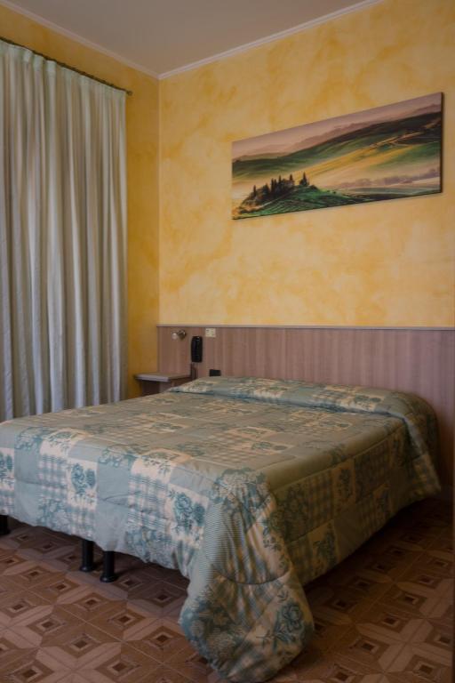 Postel nebo postele na pokoji v ubytování Albergo Etrusco