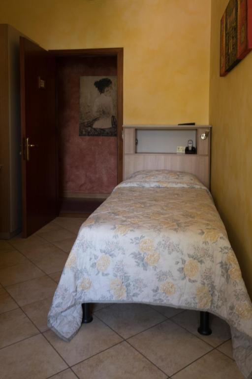 Postel nebo postele na pokoji v ubytování Albergo Etrusco