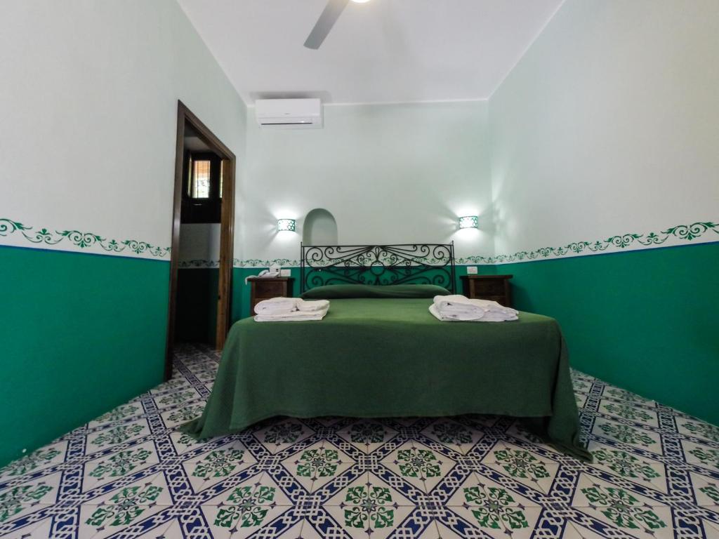 Postel nebo postele na pokoji v ubytování Hotel Arcangelo - Salina