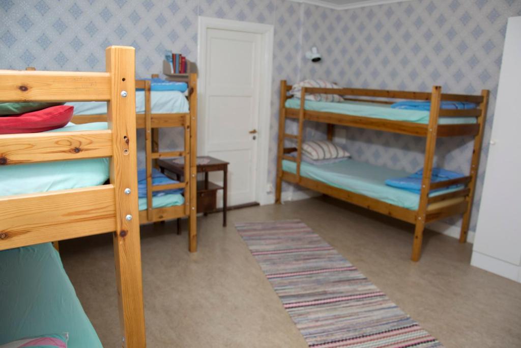 Postel nebo postele na pokoji v ubytování Örtagården