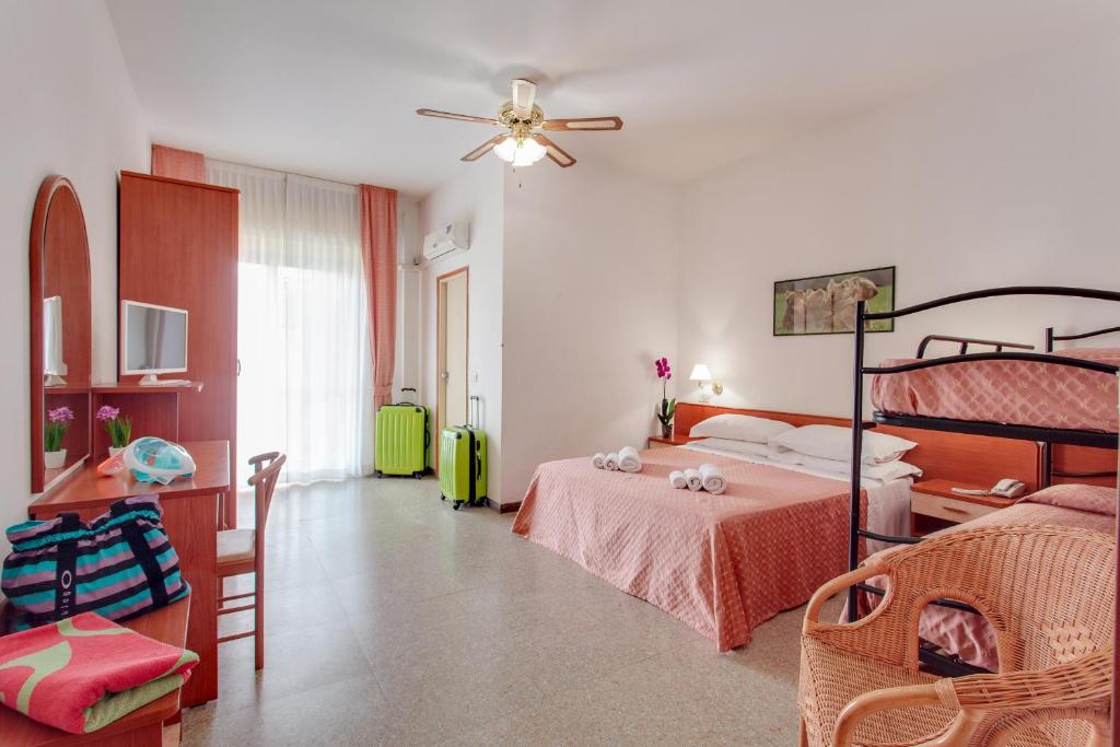 Postel nebo postele na pokoji v ubytování Hotel Rosa