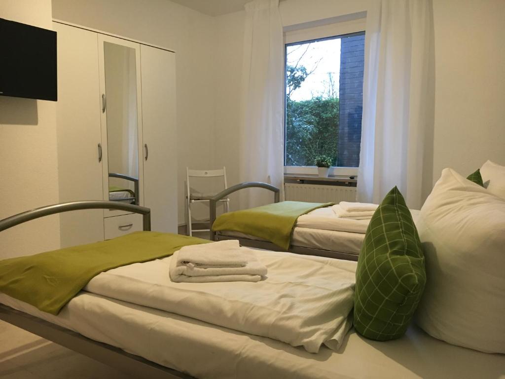 Llit o llits en una habitació de SSC Sport+Seminarcenter Radevormwald