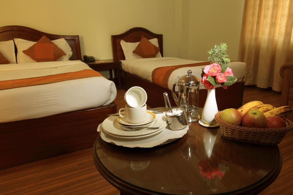 Postel nebo postele na pokoji v ubytování Samsara Boutique Hotel