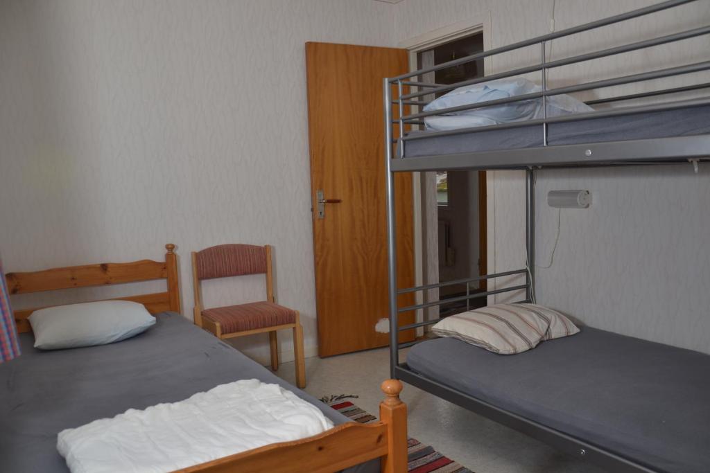 Postel nebo postele na pokoji v ubytování Örtagården