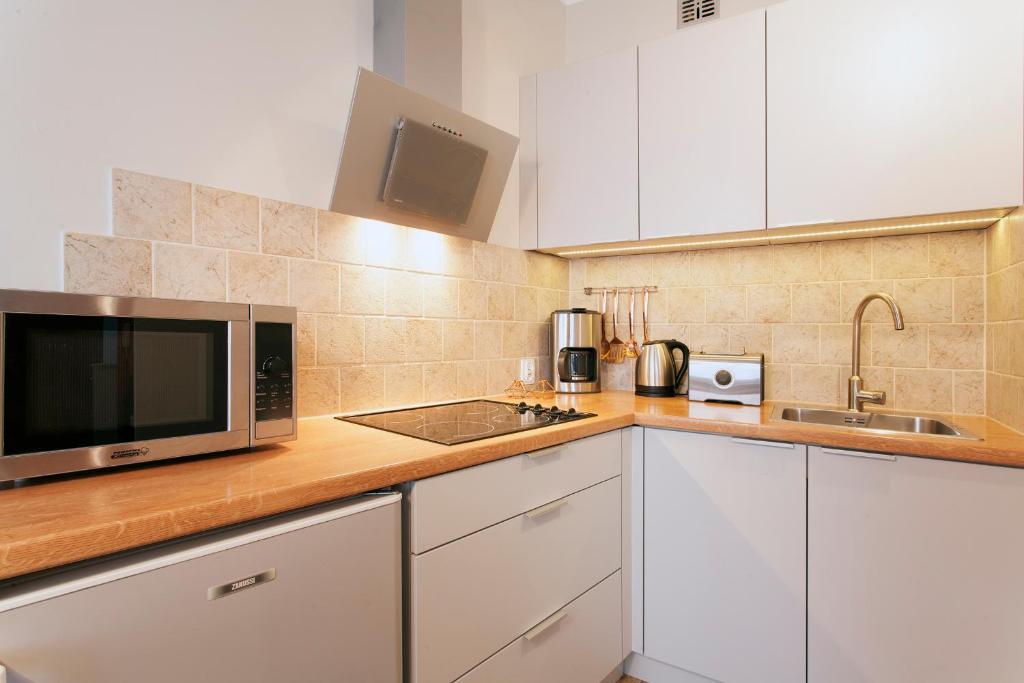 Kuchyňa alebo kuchynka v ubytovaní Mona Lisa Apartments - Kazimierz District