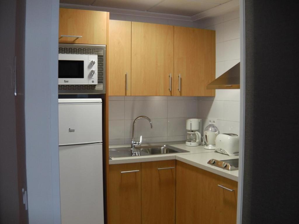 A kitchen or kitchenette at Hotel Alfonso