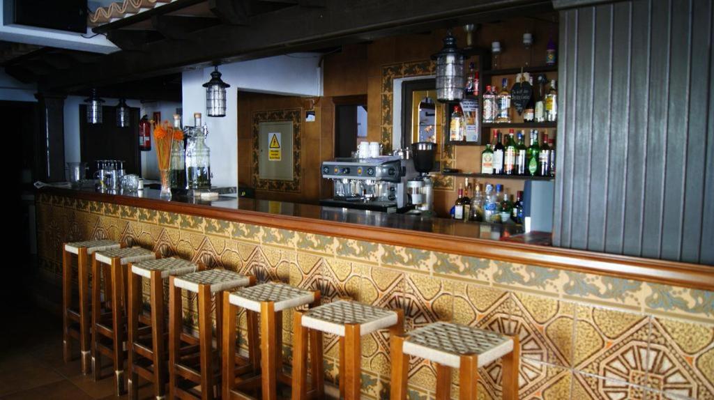 The lounge or bar area at Hotel Alfonso