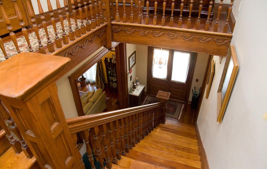 an overhead view of a staircase in a house at 1896 O'Malley House in New Orleans
