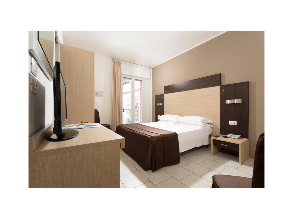 Postel nebo postele na pokoji v ubytování Hotel Gardenia