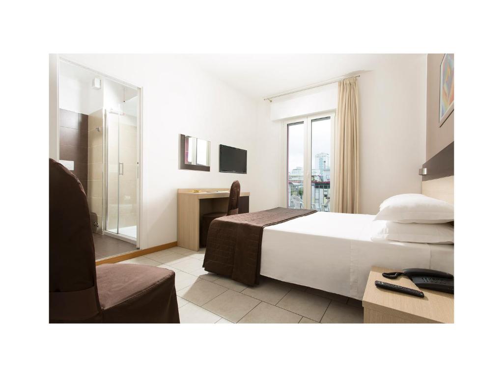Postel nebo postele na pokoji v ubytování Hotel Gardenia