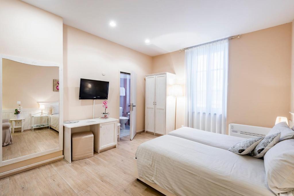 Letto o letti in una camera di Albergo Ristorante La Palma