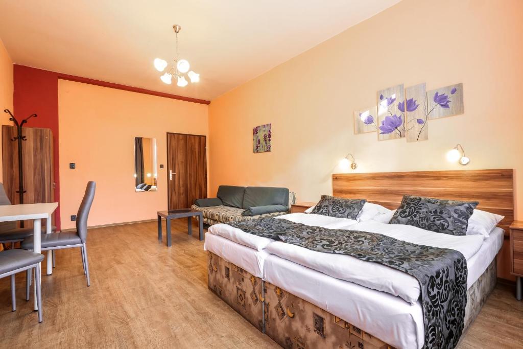 Postel nebo postele na pokoji v ubytování Rezidence Davids Apartments