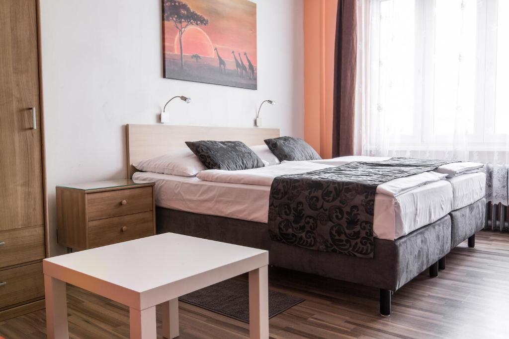 Postel nebo postele na pokoji v ubytování Rezidence Davids Apartments